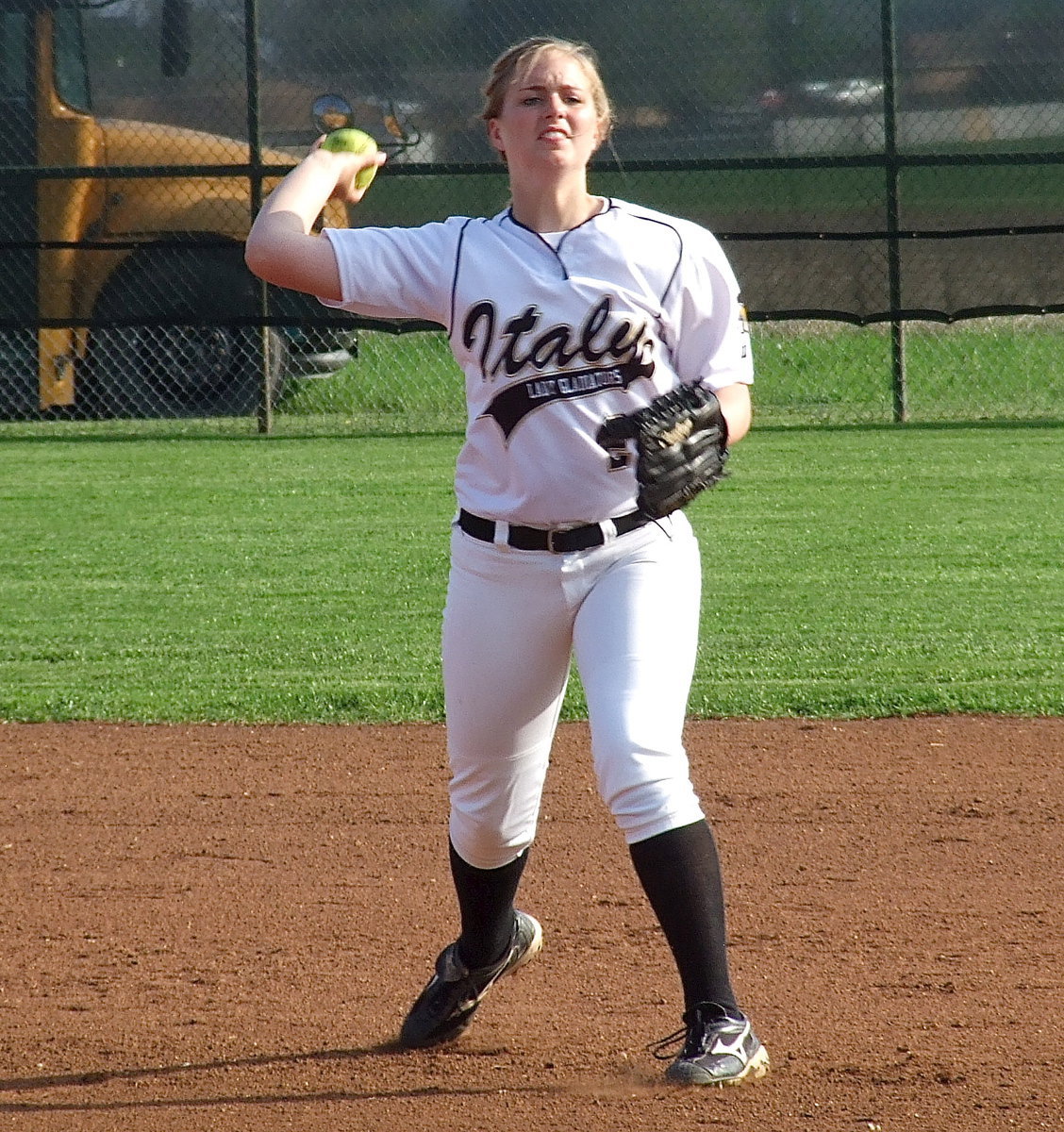 Image: Shortstop Madison Washington(2) is intense even during warm ups.