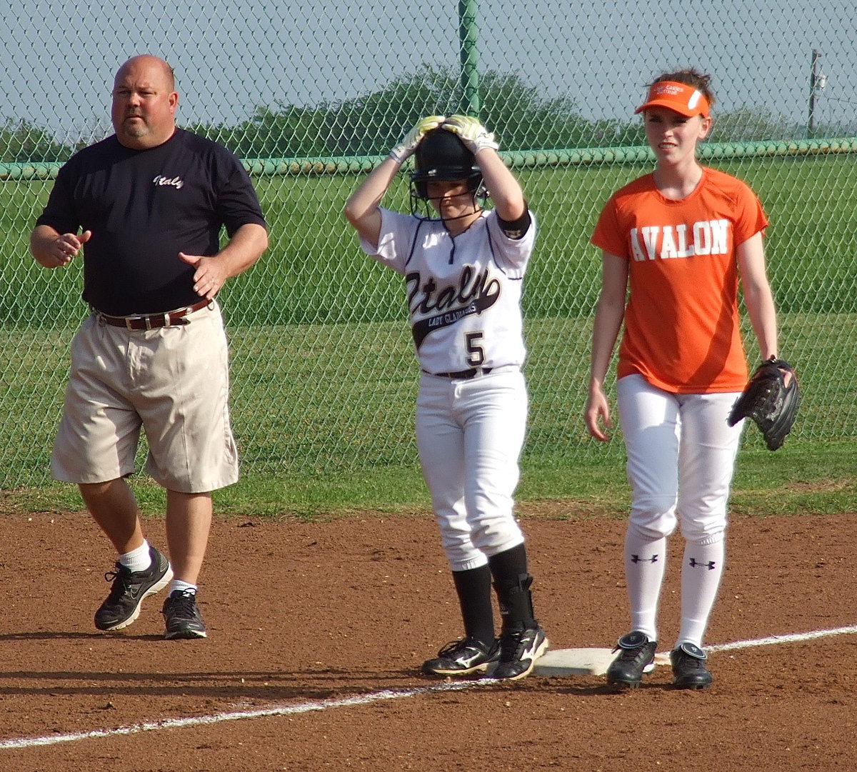 Image: Hang on to your hats, the Lady Gladiators are 9-0 and show no signs of slowing down as head coach Wayne Rowe and sophomore Tara Wallis(5) try to wrap up an undefeated district title.