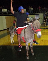 Image: It’s tough being a celebrity but even legendary Gladiator and former NFL star, Keith Davis, seemed to have the ride of his life during the hilarious Donkey Basketball game sponsored by the Italy Gladiator Band Boosters and held inside Italy Coliseum.