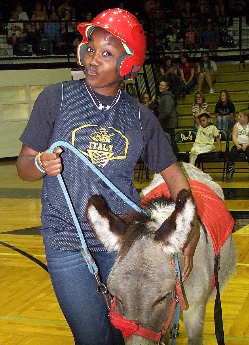 Image: Lady Gladiator volleyball head coach Jessika Robinson learns the hard way what it feels like to be the one getting spiked.