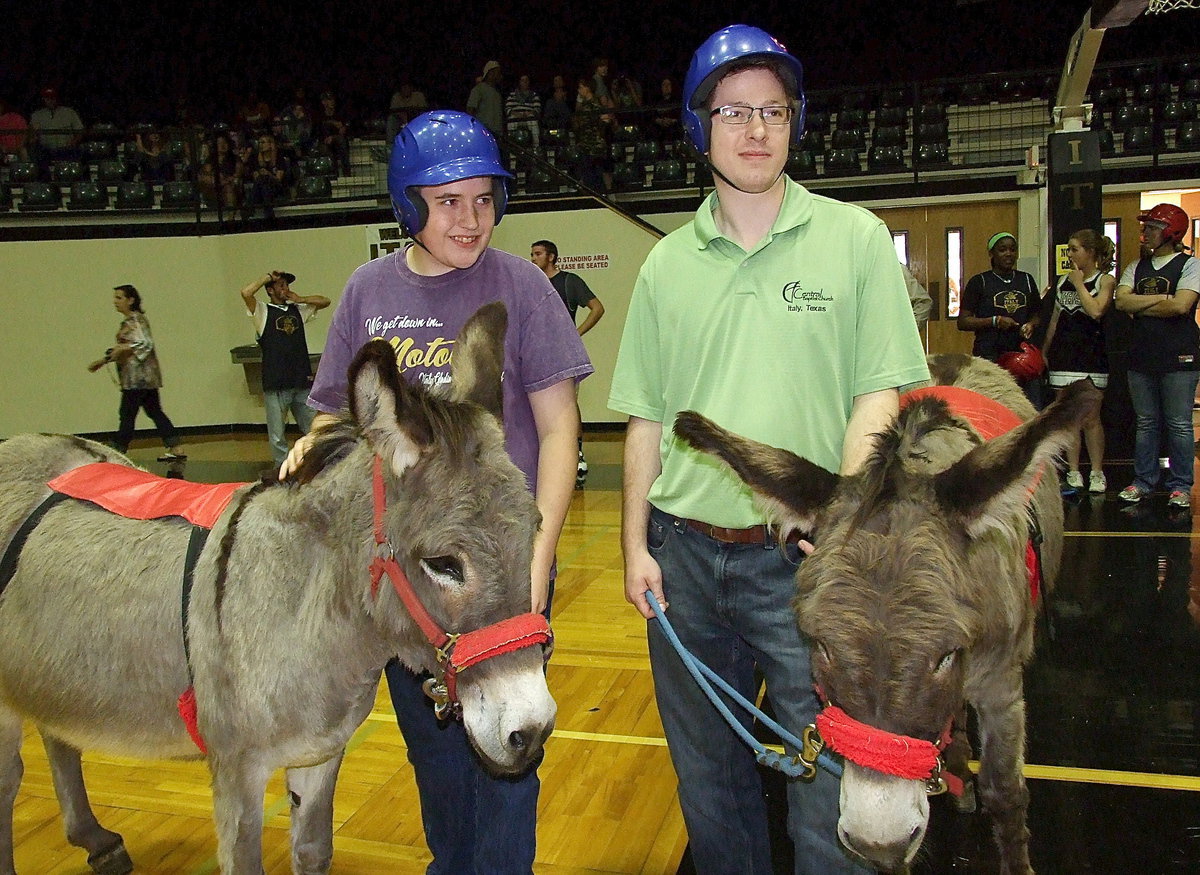 Image: Brett Kirton, Gladiator Regiment Band member (drumline) and Joseph Barrett, pastor of Central Baptist Church of Italy, team up for donkey basketball fun.