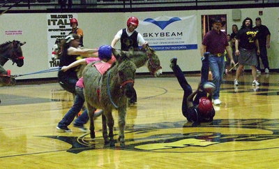 Image: Girls volleyball coach Jessika Robinson hits the court hard after losing her donkey.