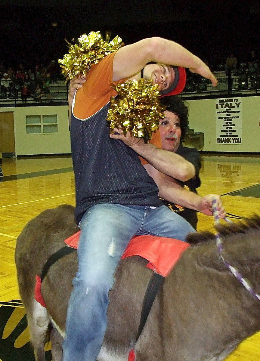 Image: Cheerleader Larry Eubank congratulates Chase Hamilton on scoring a goal.