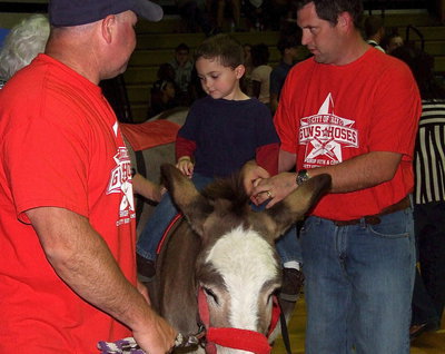 Image: During halftime, the kiddos were allowed to come down to the court for donkey rides.