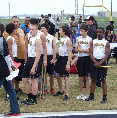 Image: Tylan Wallace, Italy Track Coach Brandon Duncan, Clay Riddle, Elliott Worsham, Dylan McCasland, Ty Hamilton and Kendrick Norwood get ready to support each other during the relay race.