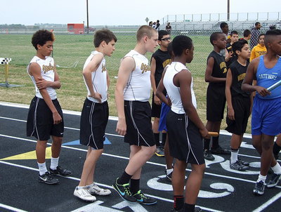 Image: Tylan Wallace, Ty Hamilton, Clay Riddle and Kendrick Norwood get mentally prepared for their relay event.