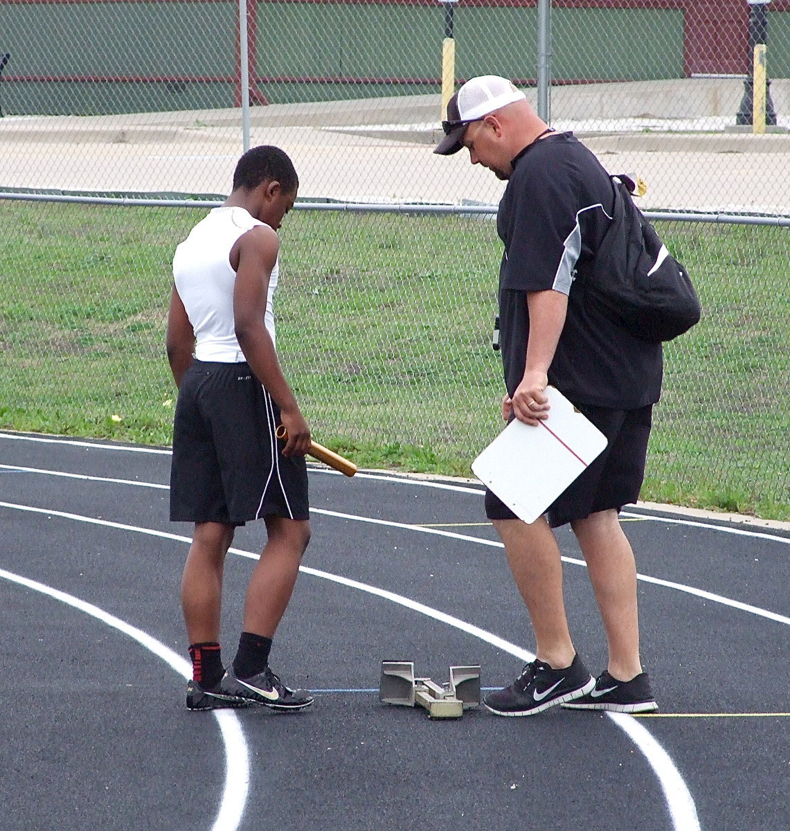 Image: Kendrick Norwood receives assistance from Italy’s AD/HFC Hank Hollywood.