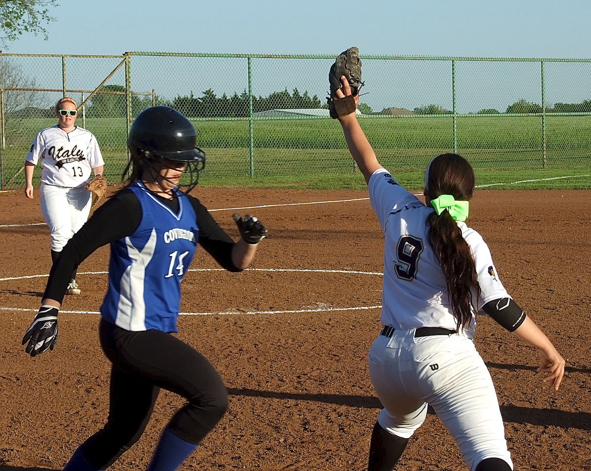 Image: Alyssa Richards(9) shows her versatility after moving to first base in the second game of a double-header against Covington,