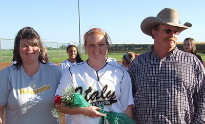 Image: Senior Lady Gladiator Katie Byers(13) is escorted by her parents Nancy and Brent Byers during a between game ceremony honoring Senior Day.