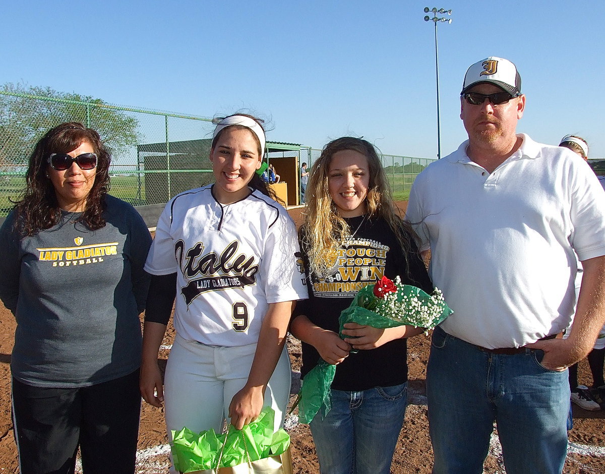 Image: Being honored on Senior Day is Lady Gladiator Alyssa Richards(9) who is escorted by her mother Tina Richards, little sister Brycelin Richards and father Allen Richards.