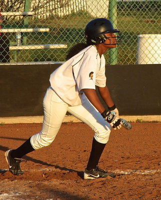 Image: Sophomore K’Breona Davis(11) records her first homerun as a Lady Gladiator with an inside-the-park effort.
