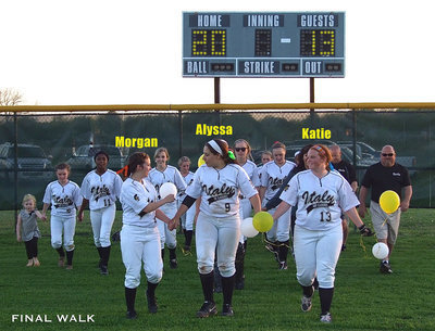 Image: Final Walk: 2013 seniors Morgan Cockerham(8), Alysa Richards(9) and Katie Byers(13) are joined during the FInal Walk by coaches, teammates and little Hannah Rowe (far left).