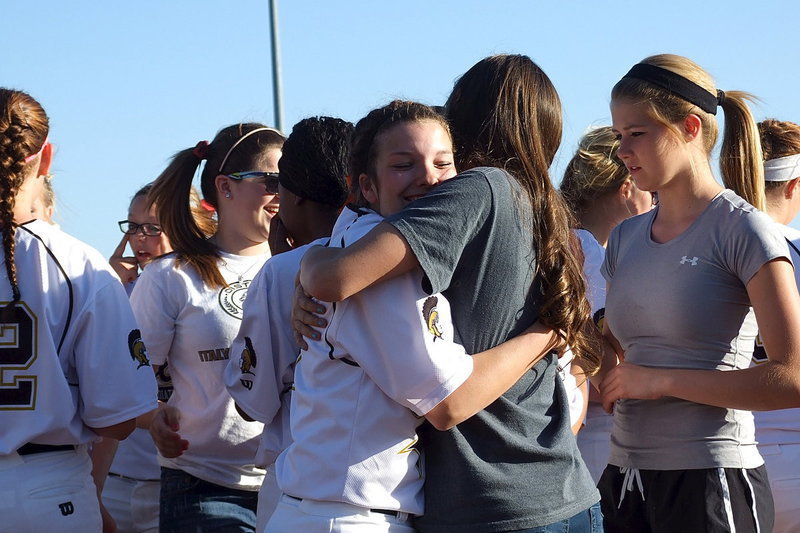 Image: Italy senior Morgan Cockerham(8) receives a hug from Jozie Perkins and the rest of her Lady Gladiator JV and varsity teammates during Senior Day which also honored fellow seniors Alyssa Richards and Katie Byers.