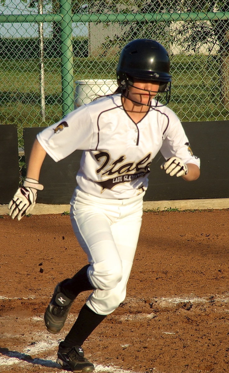 Image: Freshman Lady Gladiator Cassidy Childers(3) hustles to first base.