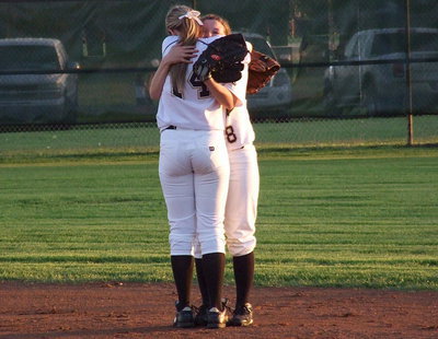Image: After the final out of the day, Kelsey Nelson(14) immediately hugs senior Morgan Cockerham(8) with Italy’s Senior Day winding down.