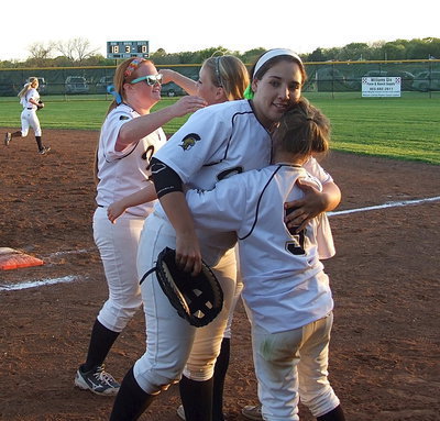 Image: More hugs; Katie Byers(13) receives a hug from teammate Hannah Washington(6) while fellow senior Alyssa Richards(9) receives a hug from teammate Tara Wallis(5).