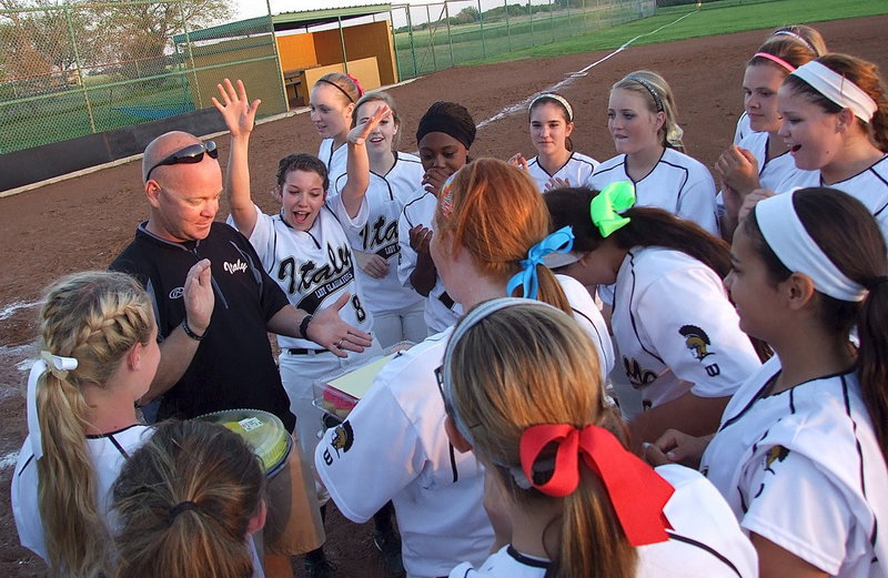 Image: Assistant Lady Gladiator Softball Coach Michael Chambers celebrates his birthday with his players.