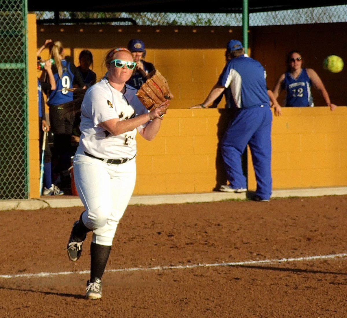 Image: Senior Lady Gladiator Katie Byers(13) warms up between innings.