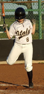 Image: Senior Morgan Cockerham(8) hot feets to avoid being struck by an inside pitch.