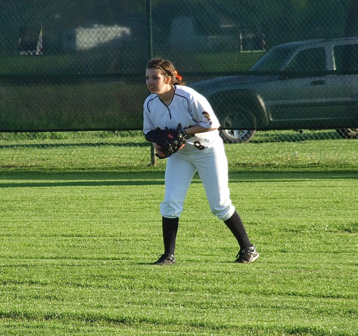 Image: Senior Morgan Cockerham(8) patrols the outfield and catches a pop fly during the second game.