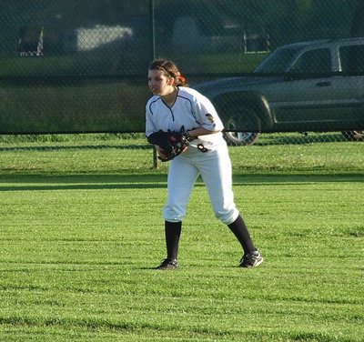 Image: Senior Morgan Cockerham(8) patrols the outfield and catches a pop fly during the second game.