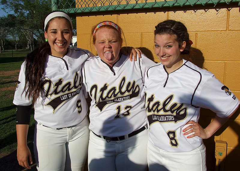 Image: Lady Gladiator seniors Alyssa Richards(9), Katie Byers(13), and Morgan Cockerham(8) take a moment between games to celebrate Senior Day with friends and family.