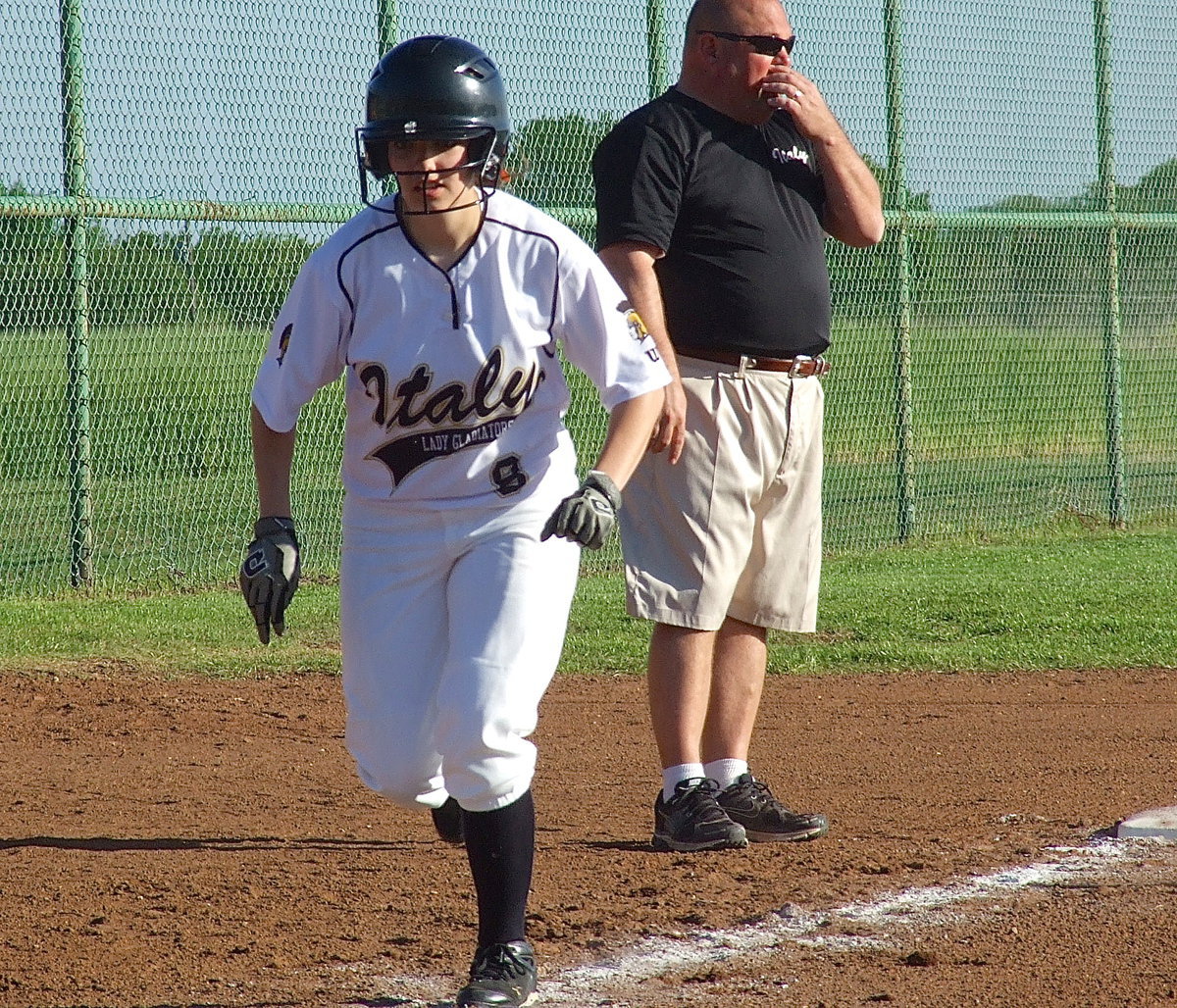 Image: Senior Morgan Cockerham(8) races home from third base.