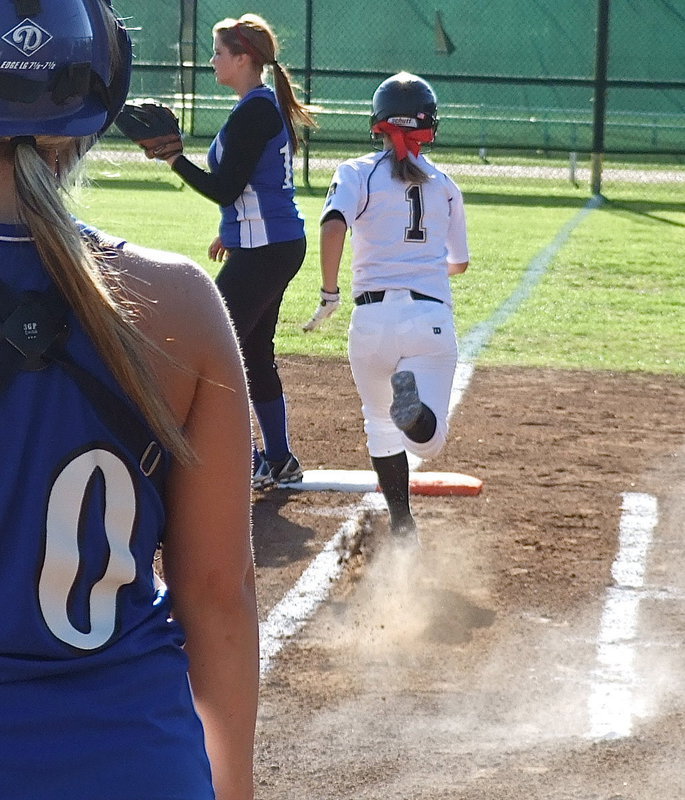 Image: Bailey Eubank(1) blazes a path to first base as the Italy Lady Gladiators cruise in two games over Covington on Friday, 21-0 and 18-0.