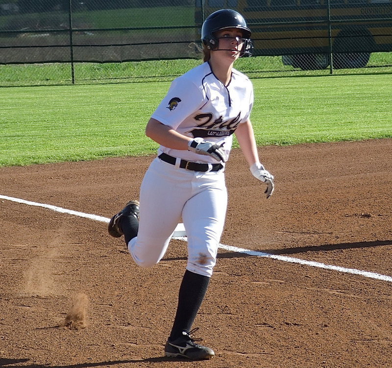 Image: Sophomore Madison Washington(2) rounds third base to score a run for the Lady Gladiators.