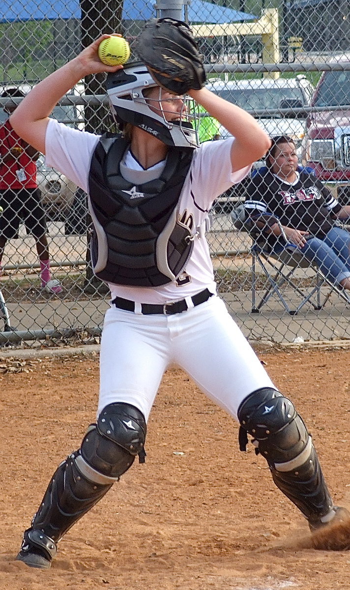 Image: Madison Washington(2) fills in at catcher and almost picks off a runner at third base.