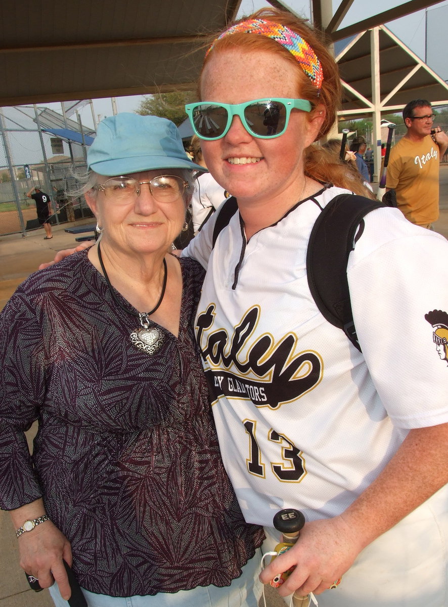 Image: Proud grandma Ann Byers gets a hug from her granddaughter and senior Lady Gladiator Katie Byers(13) after Italy wrapped up the district title.