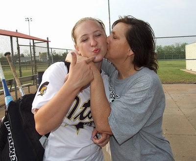 Image: Kisses all round: Proud mom Kelly Lewis gives daughter Jaclynn Lewis(15) a loving kiss with “Jac” helping to lead her Lady Gladiators to a district championship and into the playoffs.