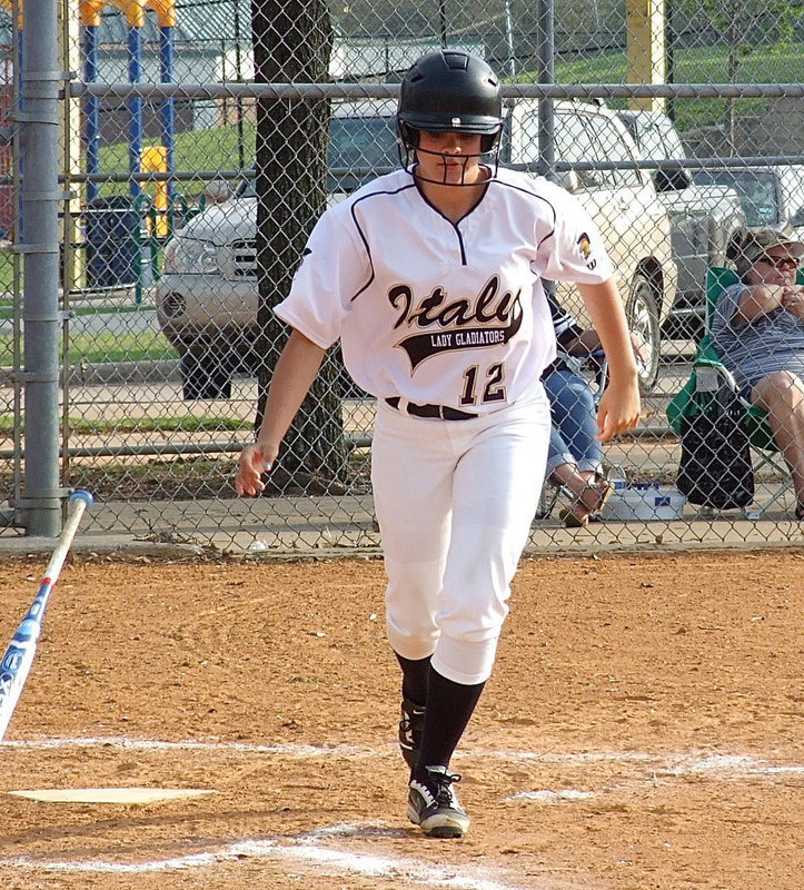 Image: Freshman Lady Gladiator Lillie Perry(12) gets walked by Faith Family.