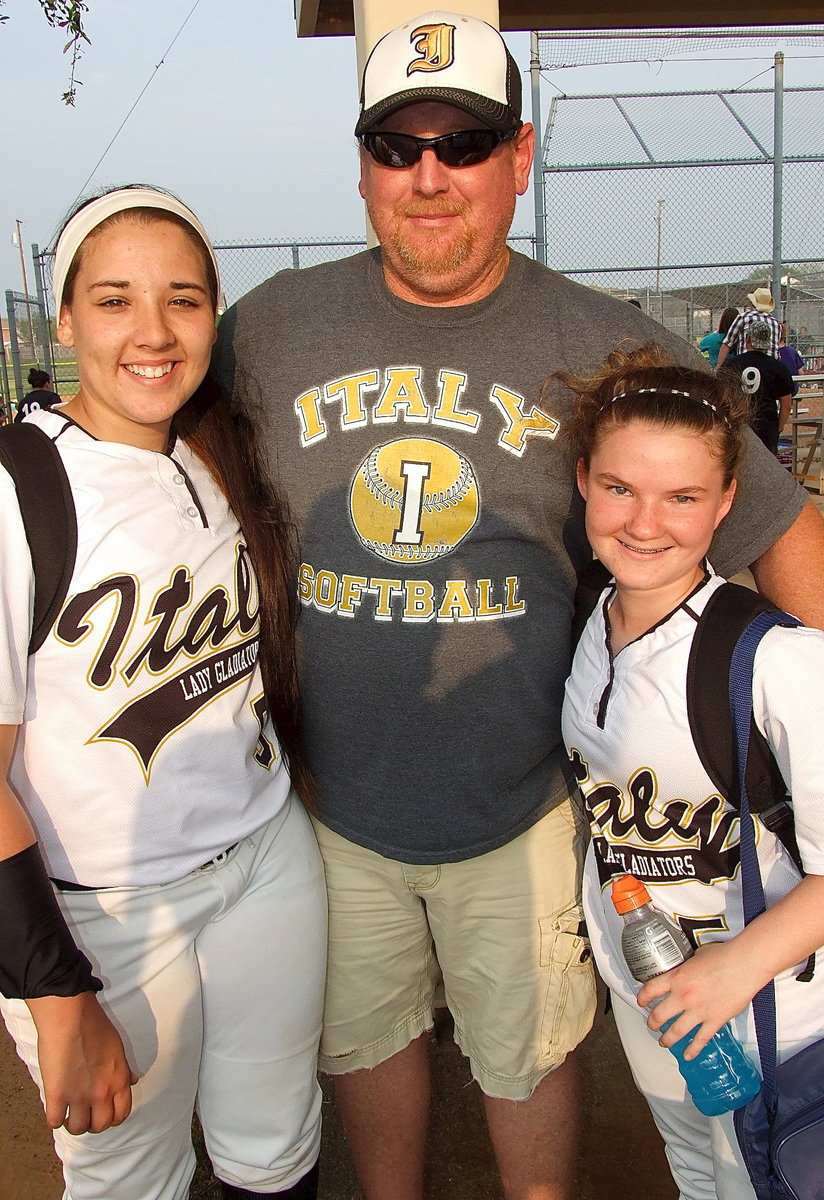 Image: Allen Richards congratulates Alyssa Richards(9) and Tara Wallis(5) on a job well done.