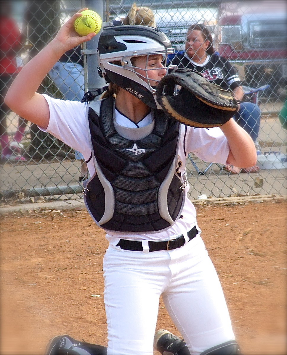 Image: Italy’s Madison Washington(2) gets some work in at catcher.