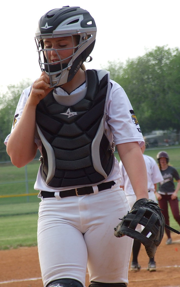 Image: Madison Washington(2) returns behind the plate after almost picking off a runner at third base.