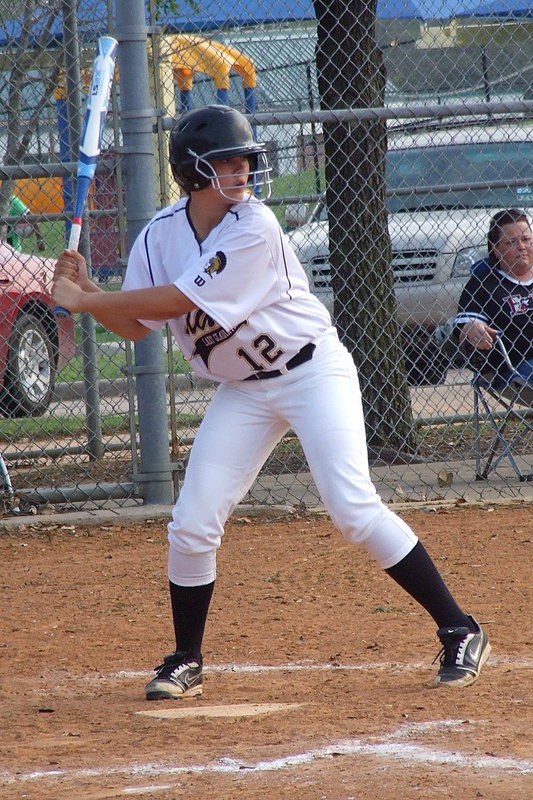 Image: Freshman Lillie Perry(12) leans back and then rockets a triple into Faith Family’s outfield.