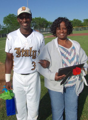 Image: Senior Marvin Cox(3) is escorted by his mother Sharon Blackshire for Senior Day 2013.