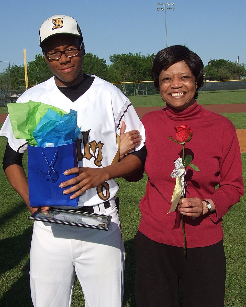 Image: Senior John “Squirt” Hughes(6) is escorted by his super proud grandmother.