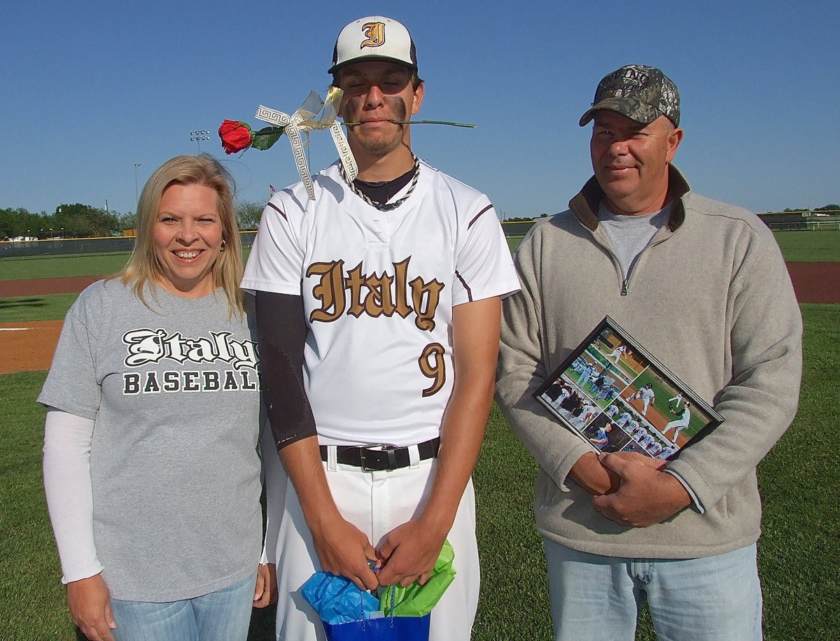 Image: Cassandra Hopkins and her husband Brad escort their son Cole Hopkins(9) on Senior Day 2013.