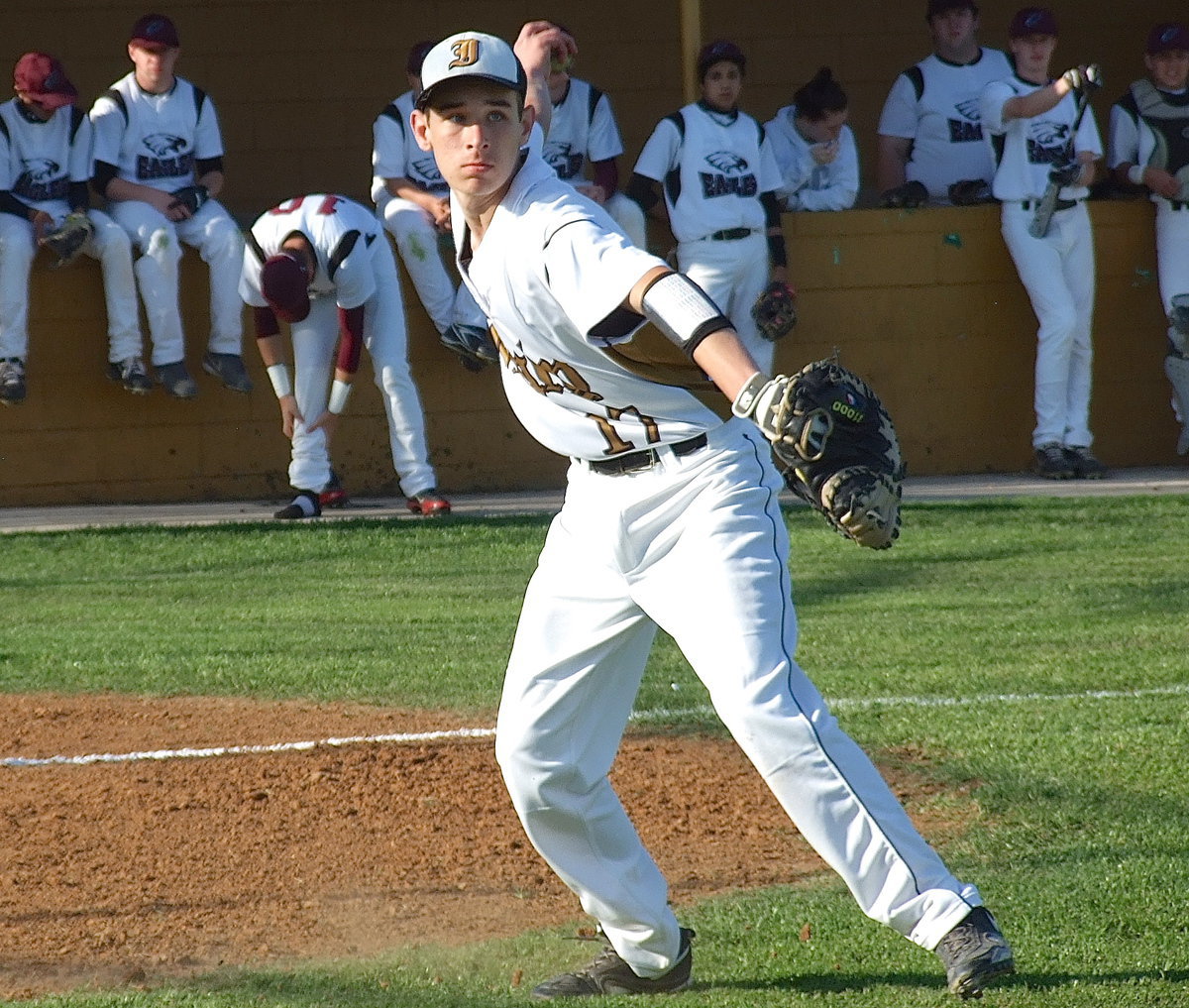 Image: Freshman catcher Ryan Connor(17) warming up before the start of the game against Waxahachie Faith Family.