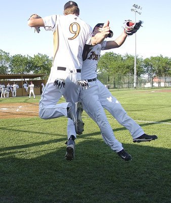 Image: Seniors Cole Hopkins(9) and Chase Hamilton(10) air collide for good luck before the game.