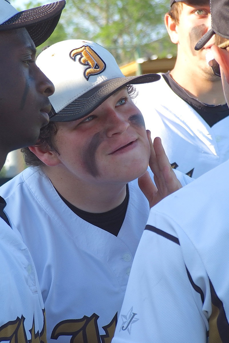 Image: Sophomore John Byers applies eye-black while using Chase Hamilton’s face and shades as a vanity while senior fashion consultants Marvin Cox and Cole Hopkins lend b-e-a-uty tips.