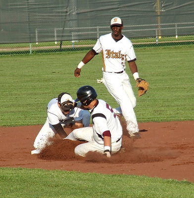 Image: Italy catcher Ryan Connor, a freshman, delivers the ball on the money to senior second baseman Reid Jacinto(5) who makes the tag against a Waxahachie Faith Family Eagle while senior shortstop Marvin Cox(3) backs up the play.