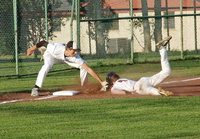 Image: Italy senior third baseman Cole Hopkins(9) makes a tag on the beak of an Eagle runner for an Italy out.