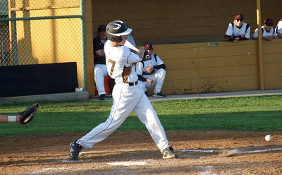 Image: Freshman, Ryan Connor(17), sends the ball down the third base line.