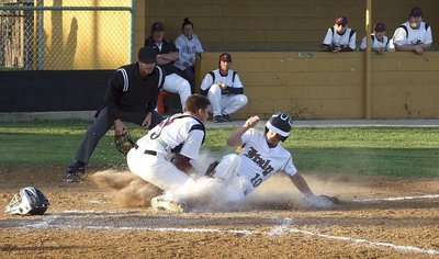 Image: Aggressive senior Chase Hamilton(10) takes a chance and then slides into home but Waxahachie’s defense make’s the play for the out. No guts—no glory!