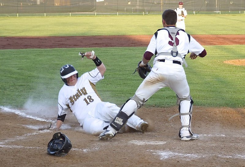 Image: Italy sophomore John Byers(18) slides across home plate for another Italy run.