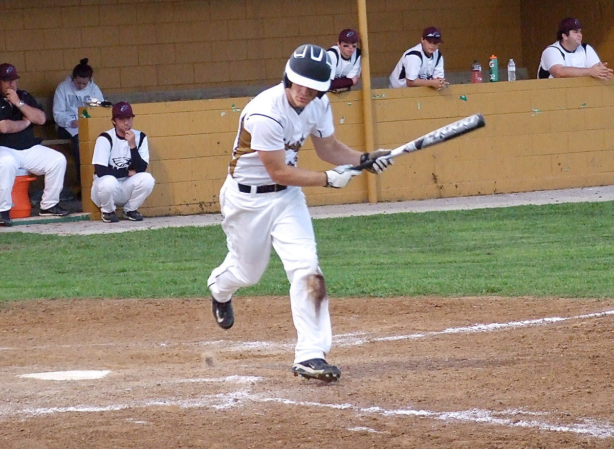 Image: Chase Hamilton(10) earns a walk and hustles to first.