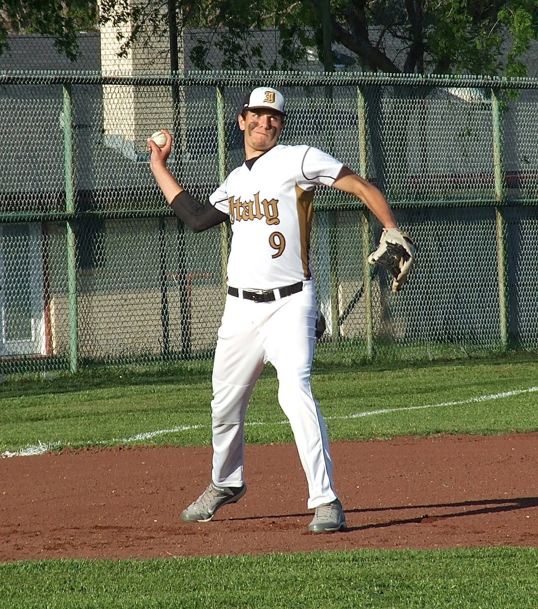 Image: Third baseman Cole Hopkins(9) throws to first base during Senior Day.